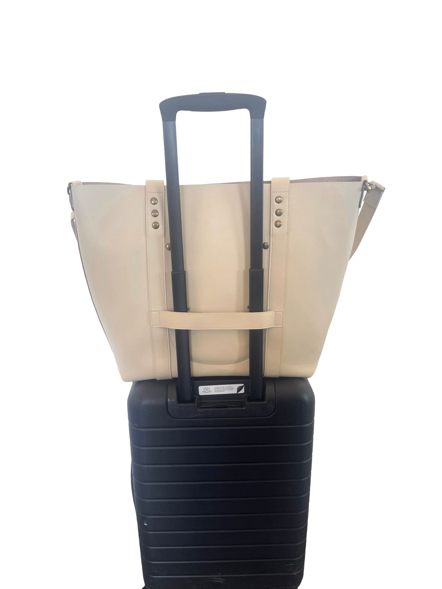 the everywhere tote ivory back on luggage